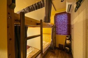 a bedroom with two bunk beds in a room at IKIDANE Cozy Hotel Haneda Airport - Vacation STAY 25827v in Tokyo