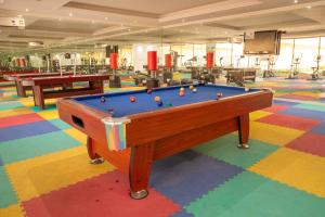 a pool table in a room with a colorful floor at Suite 777 in Jeddah