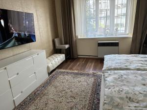 Posteľ alebo postele v izbe v ubytovaní APARTMEN PRAHA