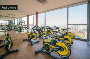 a row of exercise bikes in a gym at Charlie For You Moema in Sao Paulo