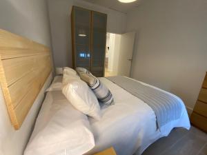 Ένα ή περισσότερα κρεβάτια σε δωμάτιο στο Aracena Flat Noria
