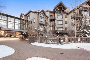 a large building with a fence in front of it at Capitol Peak 3317 in Aspen