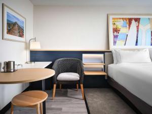 Voodi või voodid majutusasutuse Hilton Garden Inn Cocoa Beach-Oceanfront, FL toas