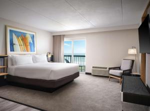 Voodi või voodid majutusasutuse Hilton Garden Inn Cocoa Beach-Oceanfront, FL toas