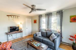 a living room with a couch and a tv at The Loft at Hebron Valley Overlook in Madison