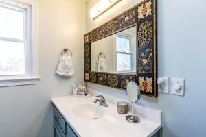 a bathroom with a sink and a mirror at The Loft at Hebron Valley Overlook in Madison +29 photos