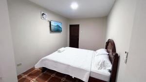 מיטה או מיטות בחדר ב-NCGSUITE ATARAZANA - Hermosa Casa muy amplia para ti