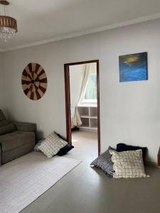 a living room with a couch and a window at Paraíso Natural, Guaratiba, Prado-BA in Prado