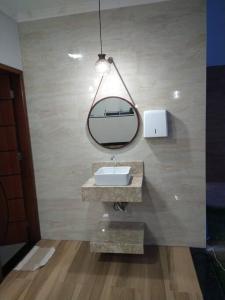 a bathroom with a sink and a mirror at Paraíso Natural, Guaratiba, Prado-BA in Prado +32 photos