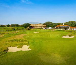 a view of a golf course with a pond at Luxury Ocean & North Foreland Golf View Escape in Broadstairs