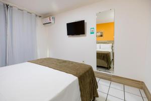 Cama ou camas em um quarto em Hotel Casa Blanca Porto Seguro