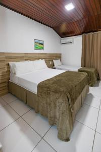 Cama ou camas em um quarto em Hotel Casa Blanca Porto Seguro