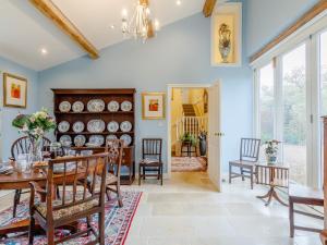 a dining room with a table and chairs at 3 Bed in Frampton on Severn 80634 in Frampton on Severn