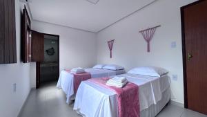 Cama ou camas em um quarto em Pousada Estrelar