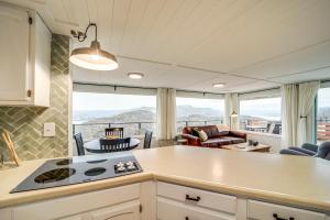 a kitchen with a view of a living room at Cozy Grand Coulee Home with Deck and Views! in Grand Coulee