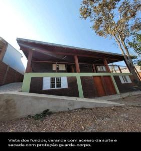 a small building with a building at Casa Ecológica Ninho do Tucano in Bonito