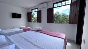 Cama ou camas em um quarto em Pousada Estrelar