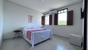 Cama ou camas em um quarto em Pousada Estrelar