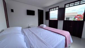 Cama ou camas em um quarto em Pousada Estrelar