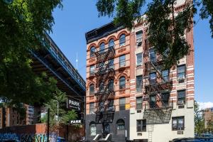 a building with fire escapes on the side of it at Apartment 235: Lower East Side in New York