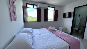 Cama ou camas em um quarto em Pousada Estrelar