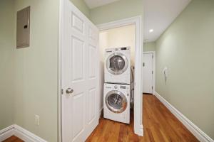 a laundry room with a washer and dryer at Apartment 494: East Village in New York