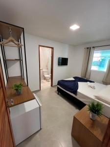 Кровать или кровати в номере Pousada Amoré em Porto de Galinhas, PE