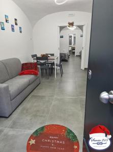 a living room with a couch and a table at Savoia 215 - Azzurra Guest House - Napoli in Naples