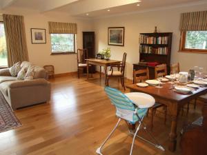 a living room with a table and a couch at Balorrin in Contin