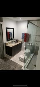 a bathroom with a shower and a sink and a toilet at Private 2BD Suite near FAU in Boca Raton
