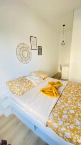a bedroom with a bed with bananas on it at Appartement standing Le Havre in Le Havre