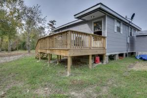 a house with a deck on the side of it at Charming Louisiana Getaway with Deck and Yard! in Destrehan