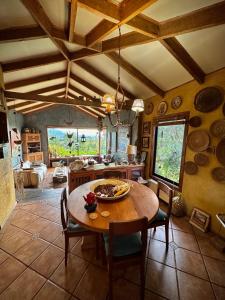 a kitchen with a table and chairs in a room at Suite con jacuzzi y bellas vistas in Lanalhue Lake