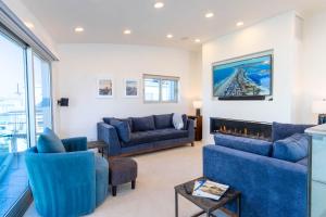 A seating area at Ocean view, two-level condo with stunning view, decks, fast WiFi & fireplace
