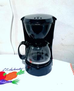 a black blender sitting on top of a table at COSTA AZUL Apartment in La Libertad