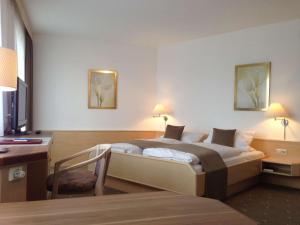 Postel nebo postele na pokoji v ubytování Arthotel Ana Panorama