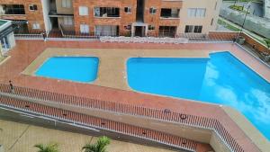 Bazén v ubytování Hermoso, moderno y confortable apartamento. nebo v jeho okolí