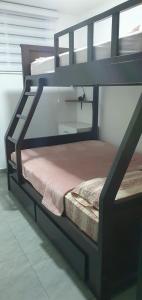 a black bunk bed in a room at Jade Aparts Salinas in Salinas