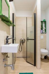 a bathroom with a sink and a shower at Apartments with WiFi Zagreb - 21954 in Zagreb