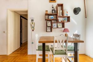 a dining room with a table and chairs at Apartments with WiFi Zagreb - 21954 in Zagreb