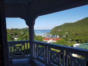 a view of the ocean from a house balcony at Casa Vista in Marigot Bay