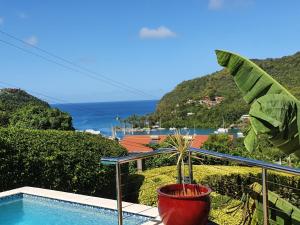 a view of the ocean from the balcony of a house at Casa Vista in Marigot Bay