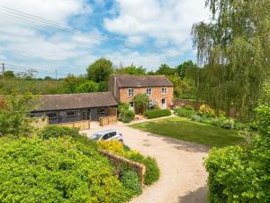 an aerial view of a house with a driveway at Long Barn in Little Marcle