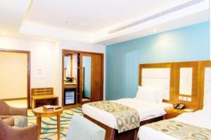 Postel nebo postele na pokoji v ubytování فندق ستي فيو- City View Hotel + 18 fotografií