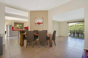 a dining room and kitchen with a table and chairs at 4 Anderson - In the heart of Bright! in Bright