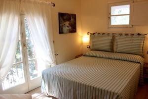 מיטה או מיטות בחדר ב-Agriturismo Terrarossa