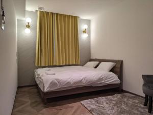 Postel nebo postele na pokoji v ubytování MARUKOU HOTEL