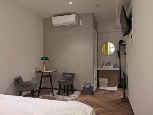 TV a/nebo společenská místnost v ubytování MARUKOU HOTEL