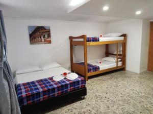 a room with two bunk beds in a room at Absolute Hotel & Hostel Boutique in Medellín