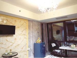A television and/or entertainment centre at Large Comfortable Bedroom in Alam Sutera Tangerang